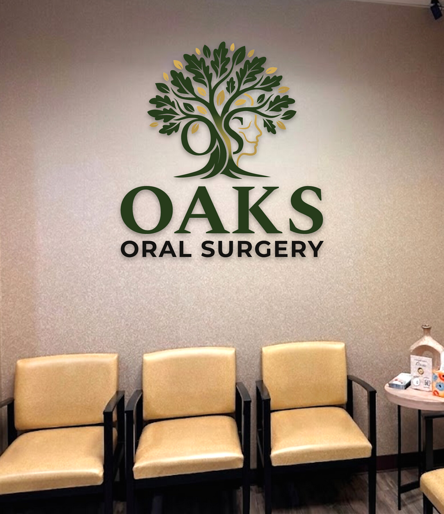 The OAKS Oral Surgery reception, with the practice mark on the wall